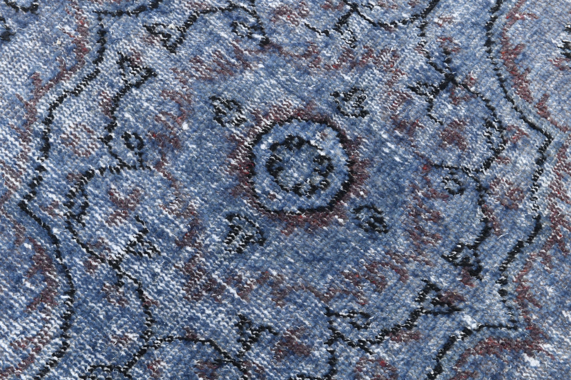Close-up of a textured blue fabric with intricate patterns
